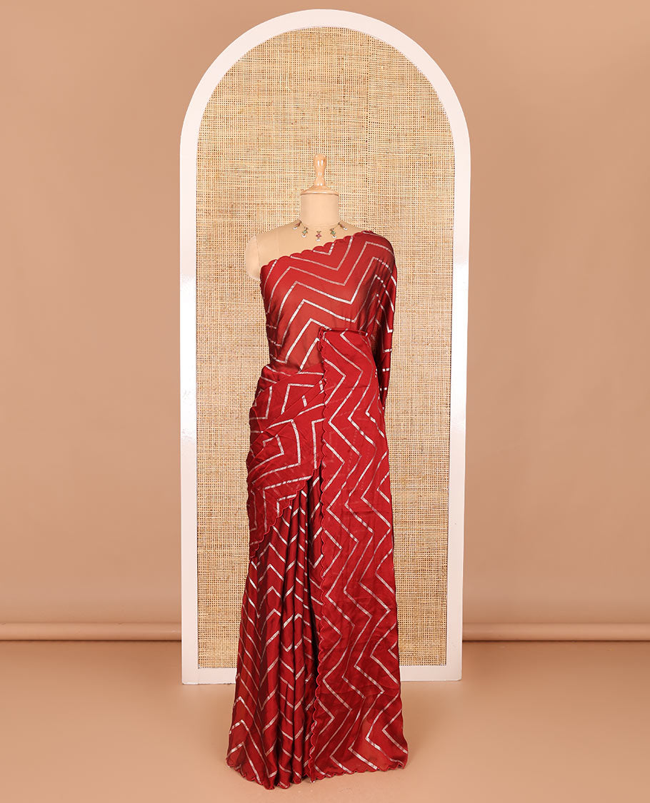 Borderless maroon zig-zag stripes gold foil printed, scallop-edged rangoli chiffon saree with a matching bandhani dotted blouse