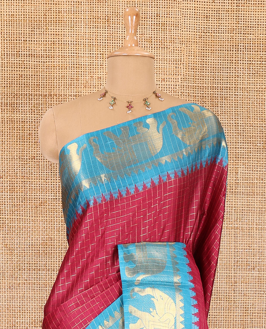 Purple zari checked semi-taffeta saree, contrast satin temple border of elephant motifs, striped pallu, and a contrast striped blouse