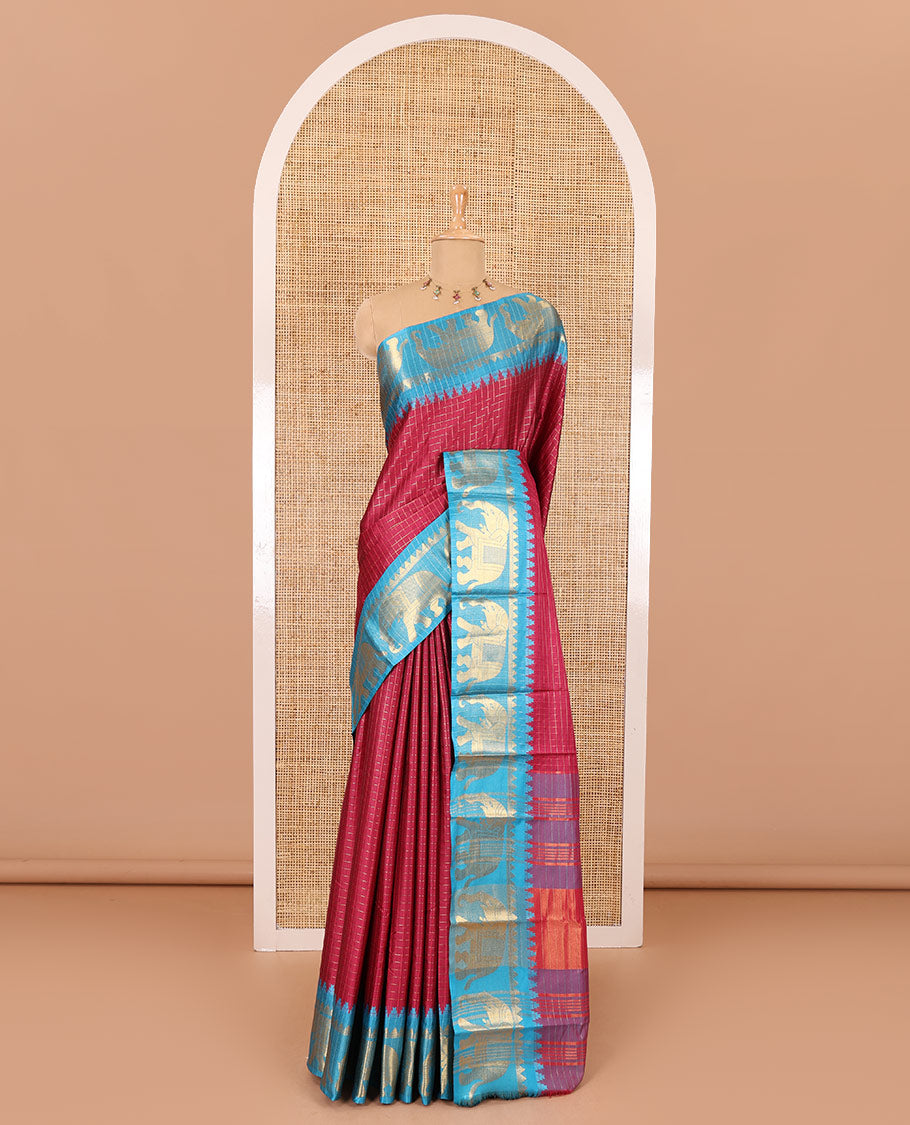 Purple zari checked semi-taffeta saree, contrast satin temple border of elephant motifs, striped pallu, and a contrast striped blouse