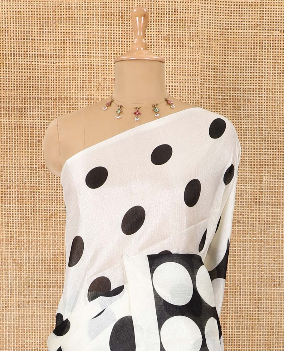 Borderless cream and black polka dots printed art khadi cotton saree, pallu steeped with polka dots, and a contrast tiny polka dots printed blouse