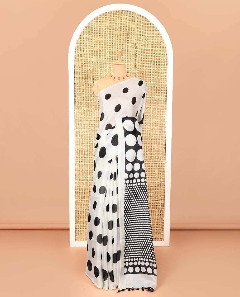 Borderless cream and black polka dots printed art khadi cotton saree, pallu steeped with polka dots, and a contrast tiny polka dots printed blouse
