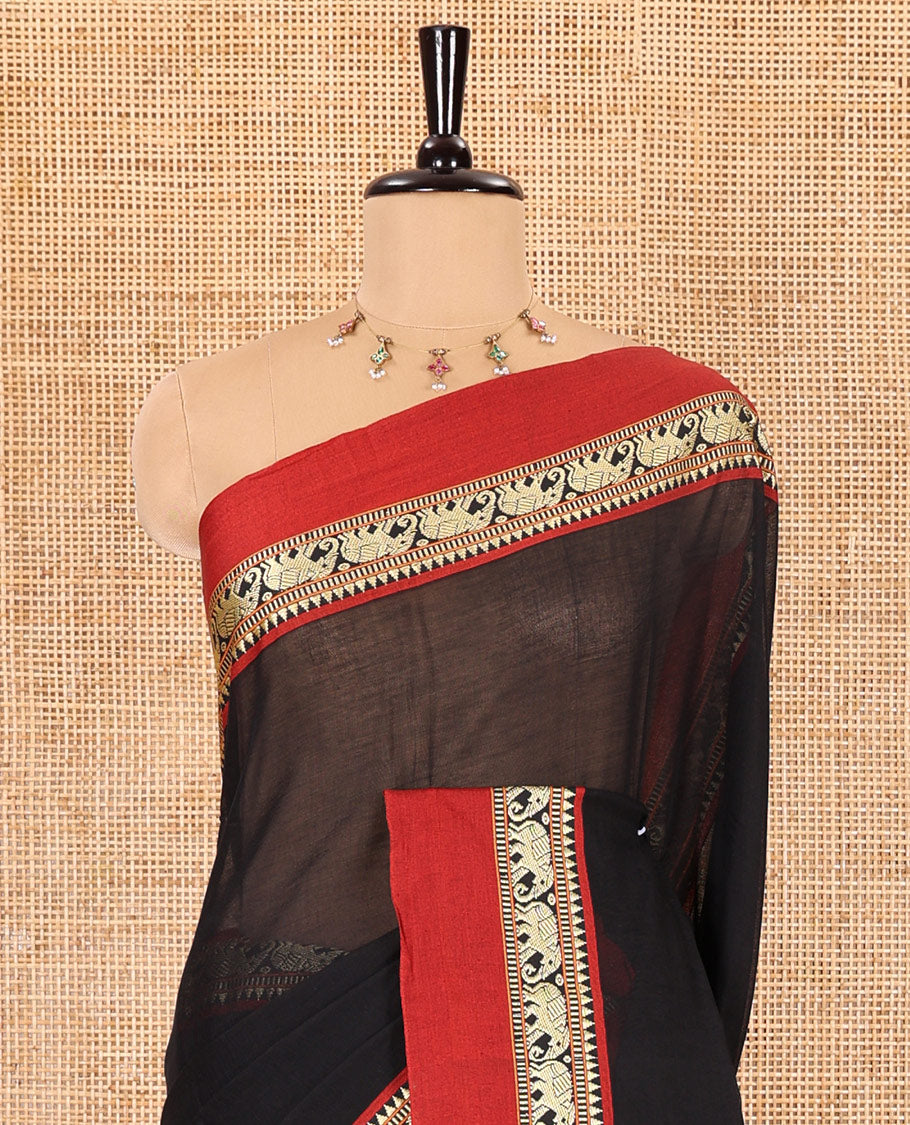 Black plain mercerised cotton saree, contrast kal erangina thread border of elephant motifs, striped pallu, and a matching blouse