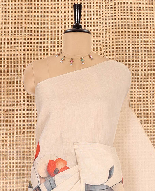 Borderless cream floral printed tissue linen saree, floral printed pallu, and a floral motifs printed blouse