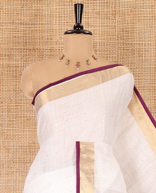 White and purple sequins striped Linen cotton saree, contrast zari sequins striped border, striped pallu, and a contrast plain blouse