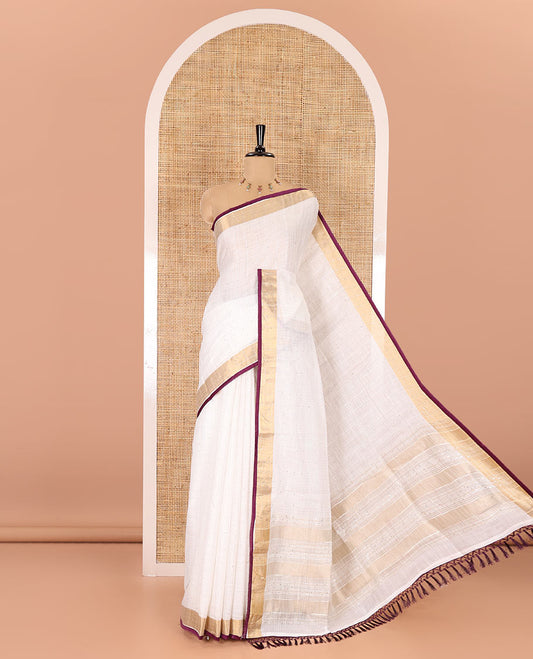 White and purple sequins striped Linen cotton saree, contrast zari sequins striped border, striped pallu, and a contrast plain blouse