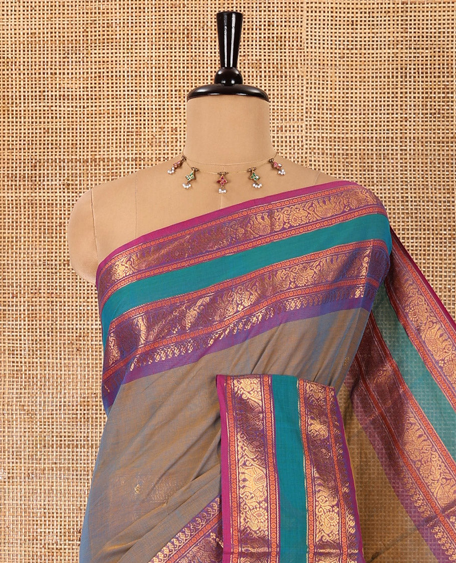 Blue dual-toned zari buttas Chettinad cotton saree, contrast traditional rettai pettu border of peacock, and elephant motifs, striped pallu, and a matching blouse