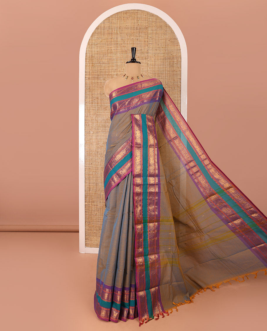 Blue dual-toned zari buttas Chettinad cotton saree, contrast traditional rettai pettu border of peacock, and elephant motifs, striped pallu, and a matching blouse