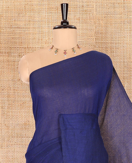 Borderless Blue Plain Khadi Mul Cotton Saree Features a Self-Pallu with Tassels, and a Matching Blouse