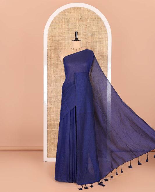 Borderless Blue Plain Khadi Mul Cotton Saree Features a Self-Pallu with Tassels, and a Matching Blouse