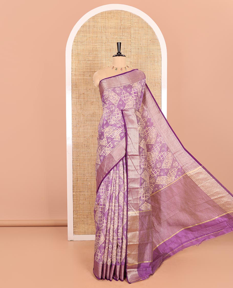 Lavender Semi-Tussar Saree Meticulously Crafted with Floral-Enclosed Diamond Patterns Printed Across the Body, Featuring a Subtly Woven Border with Traditional Zari Designs, and a Pallu Elevated with Zari Stripes, Paired with a Matching Blouse
