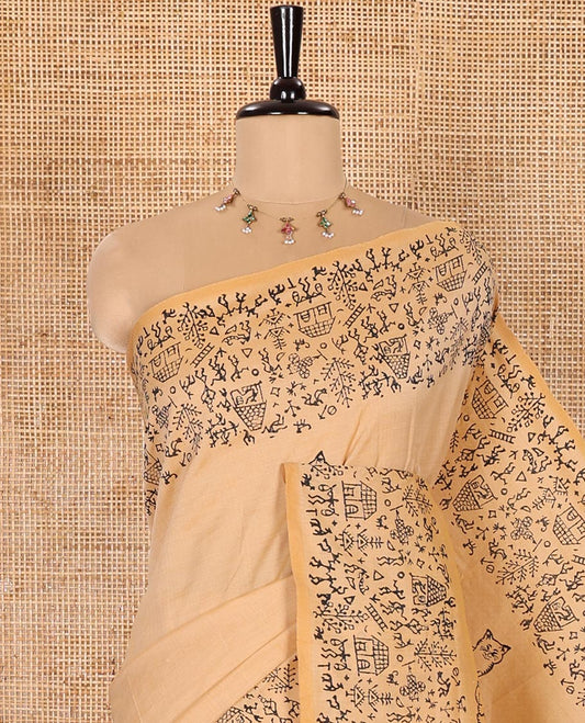 Chikku South Cotton Saree Bedecked with Cat Motifs Printed All Over Its Body, Subtly Sparked with Warli Village Theme Printed Border, and Paired with a Contrast Warli Printed Blouse