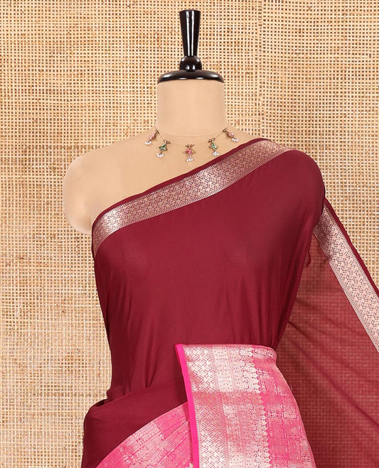 Wine and Rani Pink Half-And-Half Style Art Crepe Saree Artfully Detailed with Plain and Jacquard Design, Complemented by a Contrast Border of Traditional Zari Designs, Pallu Featuring Zari Stripes, and Paired with a Matching Blouse