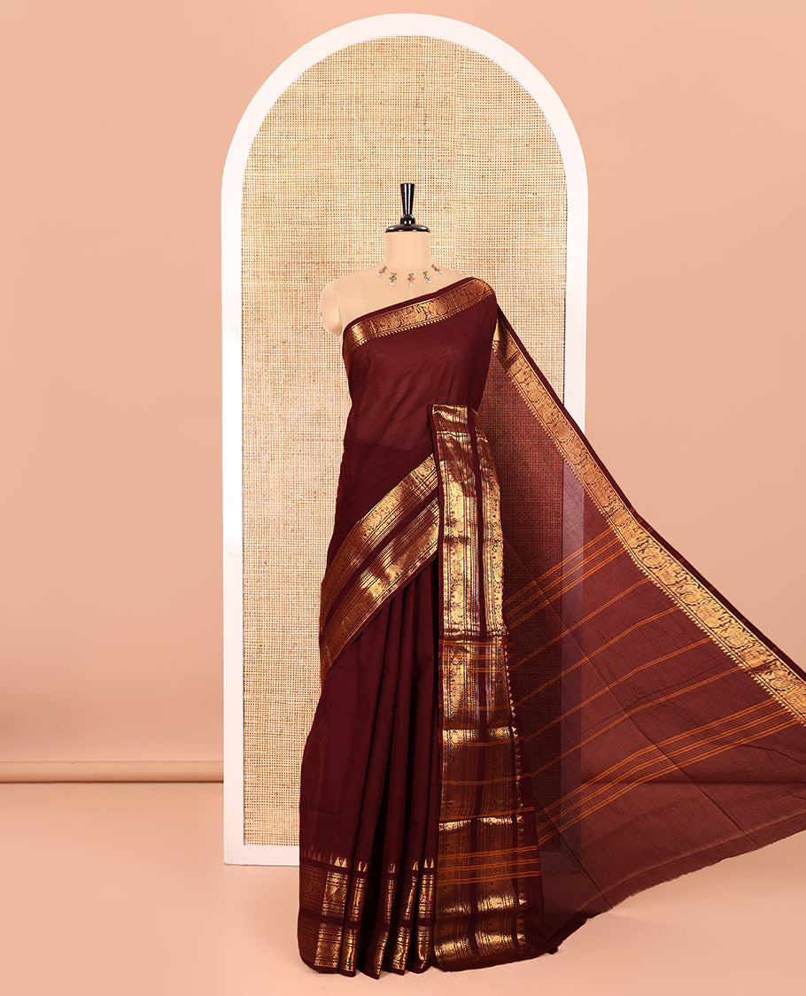 Brown Plain Chettinad Cotton Saree, Accentuated with a Gleaming Zari Rettai Pettu Border Featuring Elephant and Peacock Motifs, Subtly Striped Pallu, and Paired with a Matching Blouse