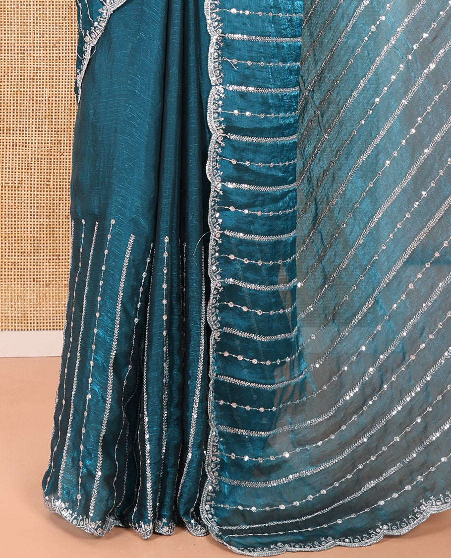 Blue Fendy Chiffon Saree Highlighted with Sequins and Thread Stripes Embroidery, Scallop Embroidered Border, Elegantly Embroidered Pallu, and Paired with a Matching Blouse