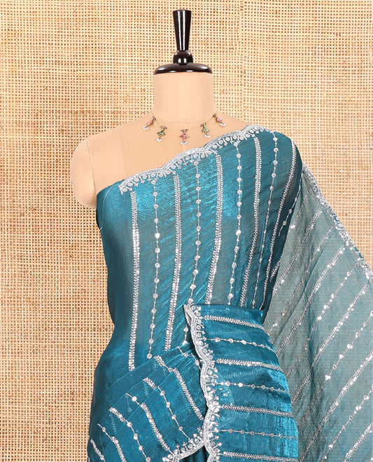 Blue Fendy Chiffon Saree Highlighted with Sequins and Thread Stripes Embroidery, Scallop Embroidered Border, Elegantly Embroidered Pallu, and Paired with a Matching Blouse