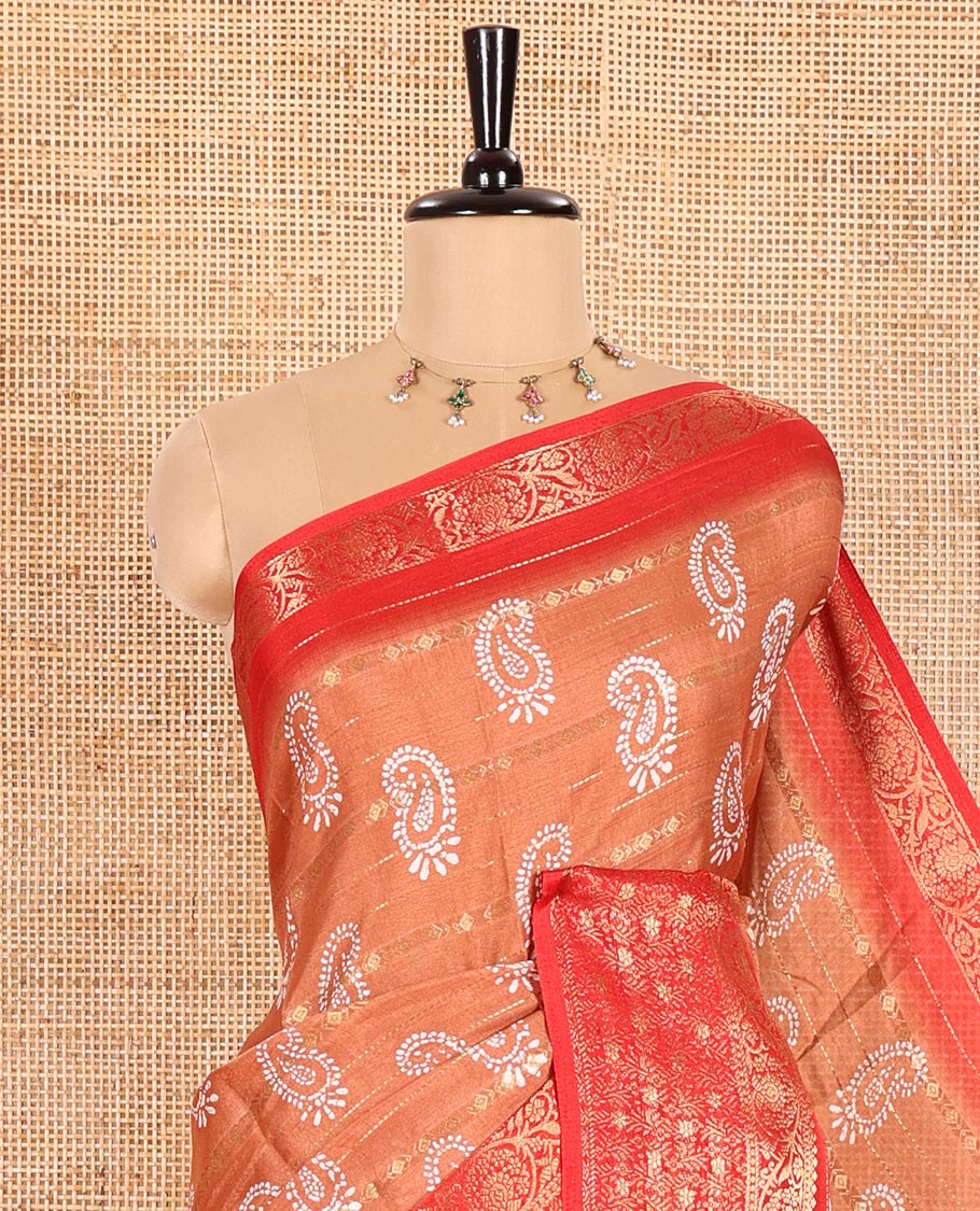 Rust Dola Silk Saree Ornamented with Paisley Buttas, and Horizontal Zari Stripes All Over Its Body, Complemented by Contrast Floral Creeper Zari Design Border, Pallu Steeped with Paisleys, and Paired with a Contrast Blouse