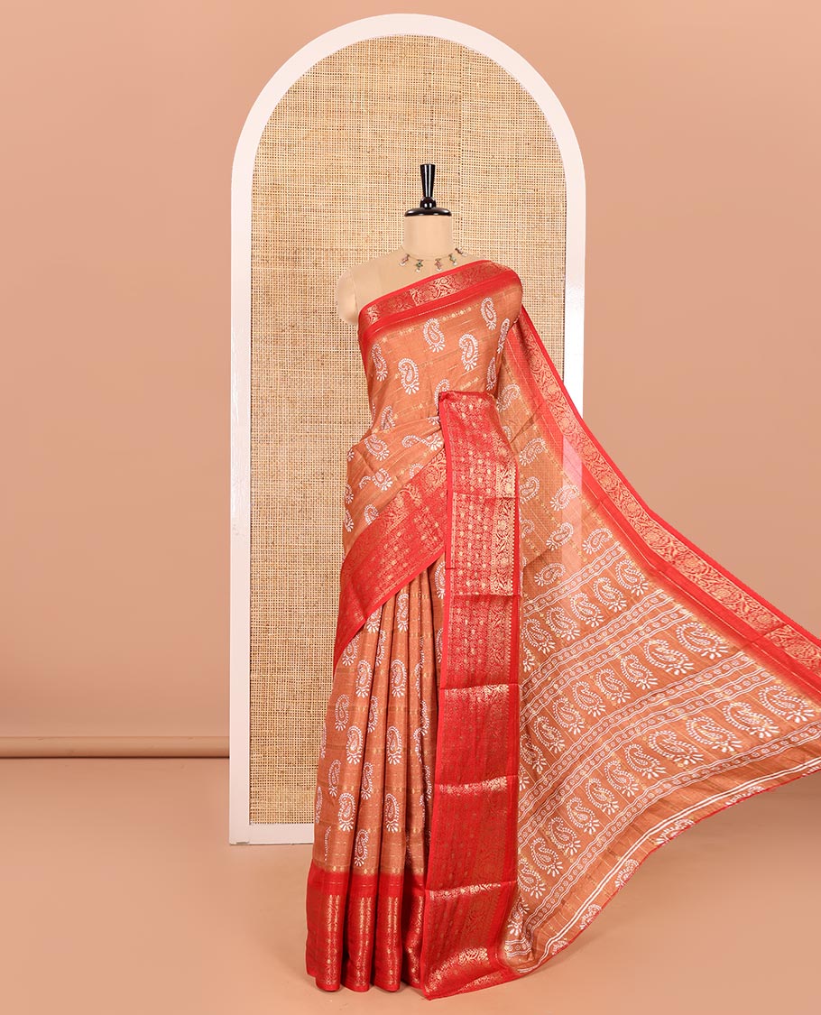 Rust Dola Silk Saree Ornamented with Paisley Buttas, and Horizontal Zari Stripes All Over Its Body, Complemented by Contrast Floral Creeper Zari Design Border, Pallu Steeped with Paisleys, and Paired with a Contrast Blouse
