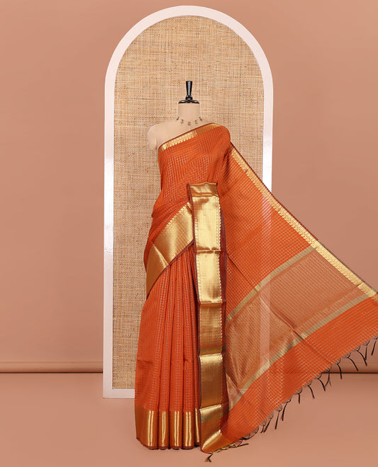 Orange Semi-Katan Silk Saree, Spotlighted with Golden Zari Checks on Its Body, Highlighted by a Traditional Zari Border of Paisley and Rudraksham Designs, Gleaming Pallu, and Paired with a Matching Blouse