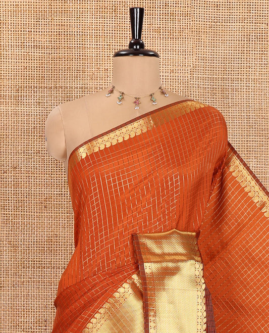 Orange Semi-Katan Silk Saree, Spotlighted with Golden Zari Checks on Its Body, Highlighted by a Traditional Zari Border of Paisley and Rudraksham Designs, Gleaming Pallu, and Paired with a Matching Blouse