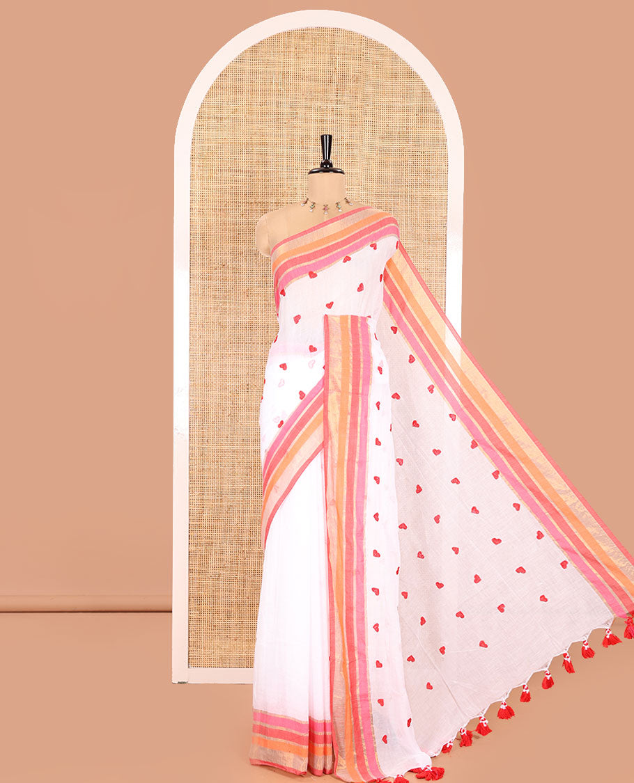 White Khadi Mul Cotton Saree, Artfully Designed Heart Motifs Embroidered on Its Body, Complemented by a Contrast Multi-Colored Striped Border, Pallu Steeped with Heart Motifs Embroidery, and Paired with a Matching Blouse