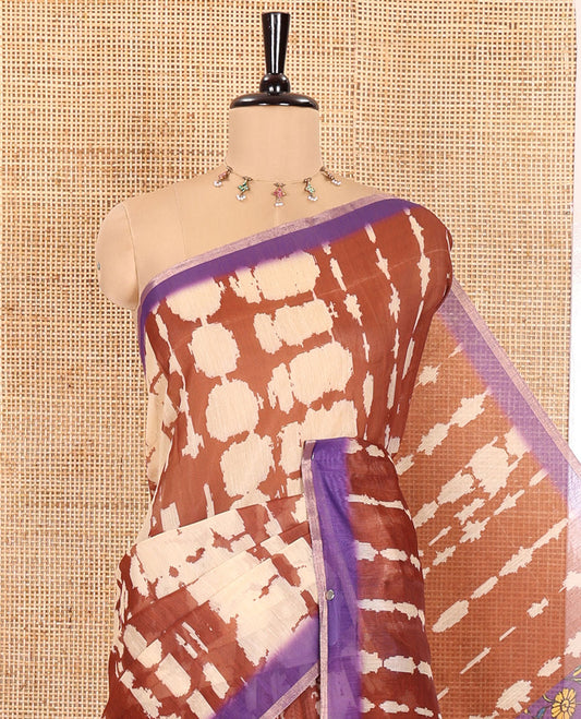 Coffee Brown Mercerised Cotton Saree, Adorned with Shibori Printed on Its Body, Complemented by a Contrast Border, Pallu Steeped with Colorful Floral Print, and Paired with a Contrast Printed Blouse