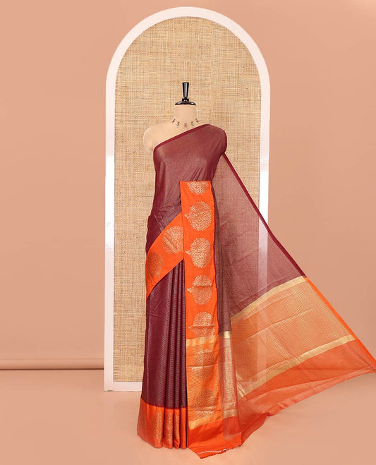 Brown Tissue-Cotton Blended Saree, Subtly Sparkled with Vertical Stripes on Its Body, Complemented by Contrast Border of Tree Motifs Woven, a Pallu Steeped with Zari Stripes, and Paired with a Contrast Blouse