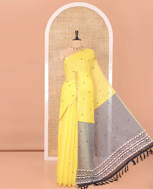 Yellow Linen Cotton Saree, Graced with Mirror Work Across Its Body, Subtly Piping Border, Contrast Pallu Steeped with Stripes, and Mirror Work, and Paired with a Contrast Vertical Stripes Printed Blouse