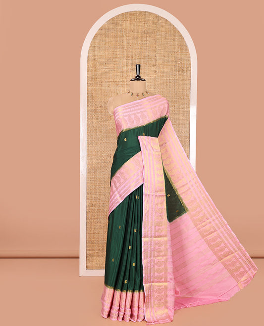 Green Art Mysore Silk Saree, Gleamed Up with Paisley Buttas All Over Its Body, Complemented by a Contrast  Traditional Zari Border of Paisleys, Subtly Striped Pallu, and Paired with a Contrast Blouse