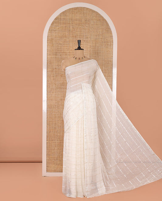 Off-White Chinon Chiffon Saree, Gracefully Embellished with Gold Zari Checked Design on Its Body, Self-Pallu, and Paired with a Contrast Elephant-Tree-Themed French Knot Embroidered Blouse