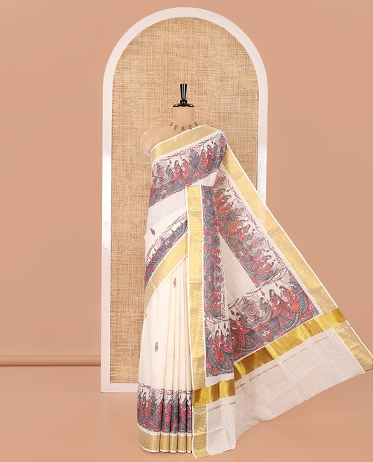 Half-White Kerala Cotton Saree, Artfully Detailed with Dancing Human Figurines Printed on Its Body, Highlighted by a Zari Border, Pallu Pictures the Same Print, and Paired with a Matching Printed Blouse