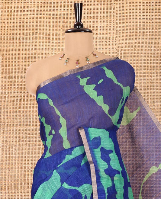 Navy Blue Linen Cotton Saree, Ornamented with Shibori Printed on Its Body, Subtle Piping Border, Pallu of Floral Vine Print, and Paired with a Contrast Floral Vine Printed Blouse