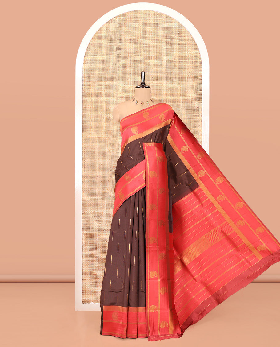 Brown and Red Kanchi Silk Saree, Accentuated with Zari Buttas All Over Its Body, Complemented by a Contrast Border of Paisleys, Zari-Striped Pallu, and Paired with a Contrast Jacquard Blouse