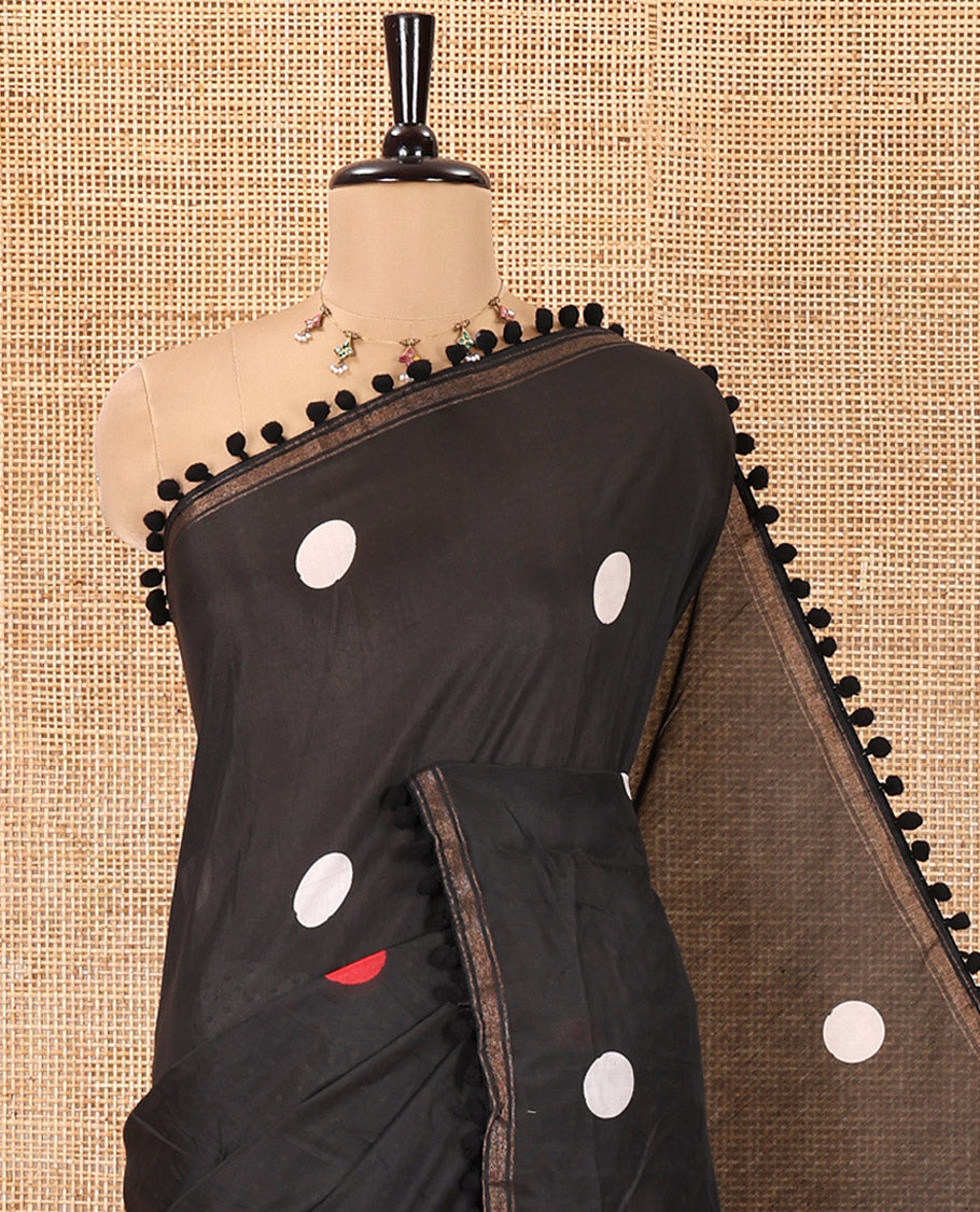 Black Chanderi Cotton Saree, Steeped with Small and Big Polka Dots on Its Body, Subtle Pom-Pom Tasseled Border, a Self-Pallu, and Paired with a Contrast Blouse