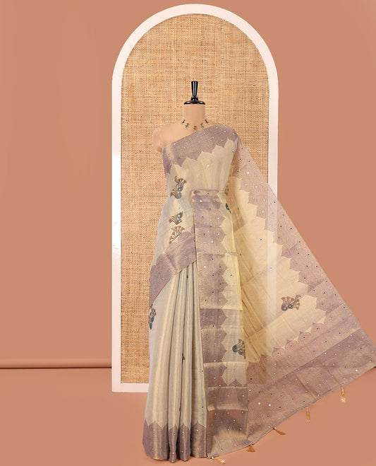 Cream Tissue Saree, Ornamented with Floral Buttas and Mirrorwork, a Self-Border, Ogee Print Pallu, and a Matching Blouse