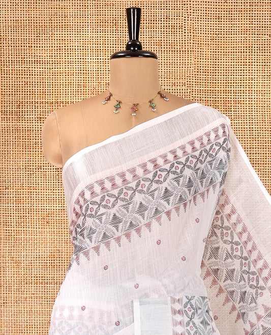 White Linen Saree, Decorated with Buttas and Geometric Print on Its Body, Highlighted by Zari Bavanji Border, Pallu of Same Geometric Print, and Paired with a Contrast Blouse