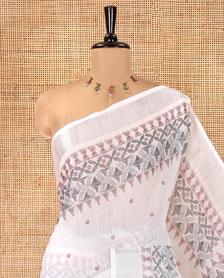 White Linen Saree, Decorated with Buttas and Geometric Print on Its Body, Highlighted by Zari Bavanji Border, Pallu of Same Geometric Print, and Paired with a Contrast Blouse