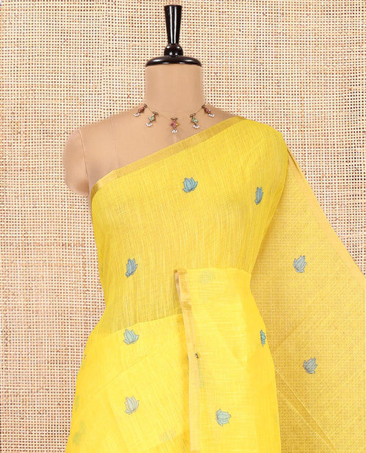 Yellow Linen Cotton Saree, Beautified with Lotus Motifs Print, a Piping Border, Contrast Floral Vine Pallu, and a Contrast Blouse