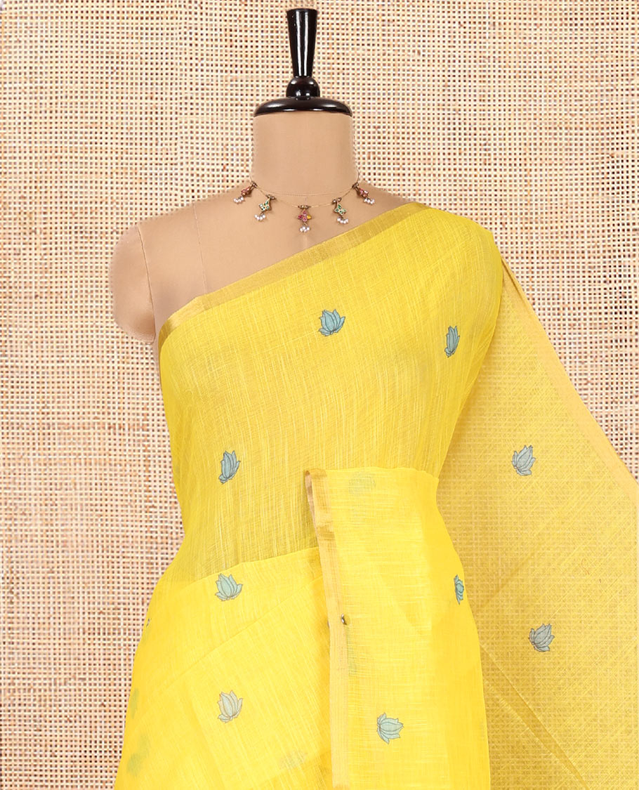 Yellow Linen Cotton Saree, Beautified with Lotus Motifs Print, a Piping Border, Contrast Floral Vine Pallu, and a Contrast Blouse