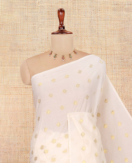 Borderless Cream Kerala Cotton Saree, Steeped with Zari Buttas, a Self-Pallu, and a Matching Blouse