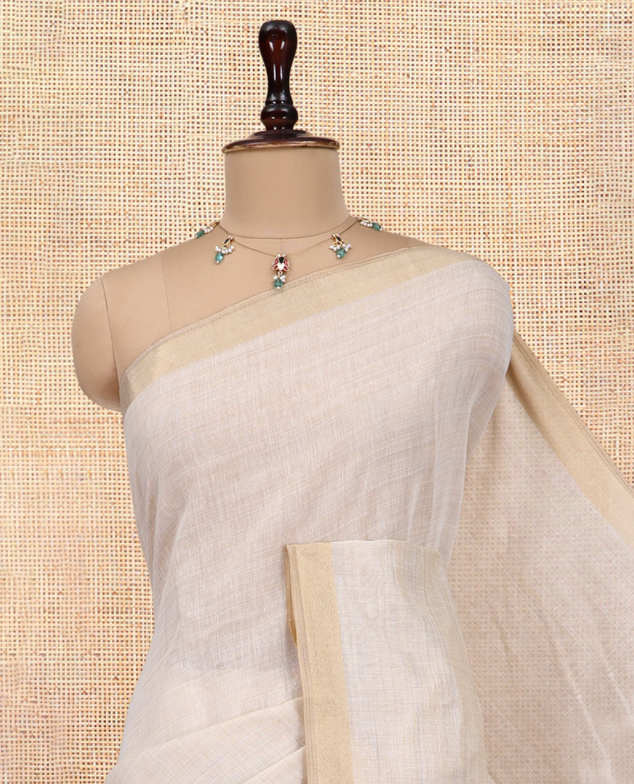 Cream Plain Semi-Tussar Saree, a Zari Border, Multi-Colored Striped Pallu, and a Contrast Blouse
