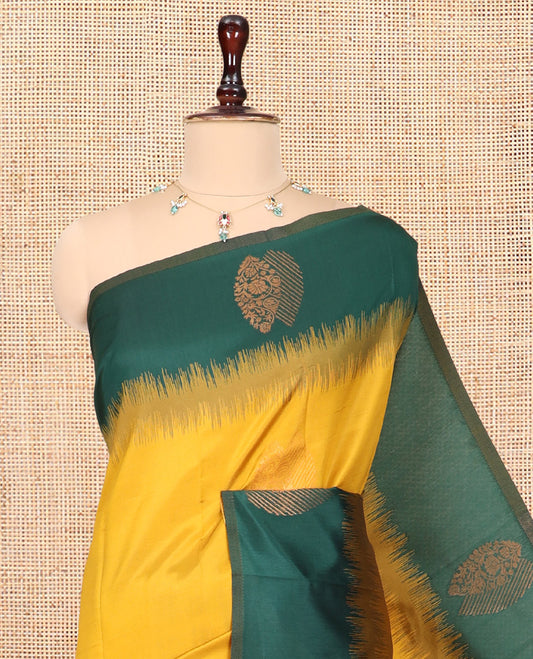 Mustard-Green Kanchi Silk Saree, Adorned with Zari Buttas, a Contrast Zari Butta Border, Grand Pallu, and a Contrast Blouse