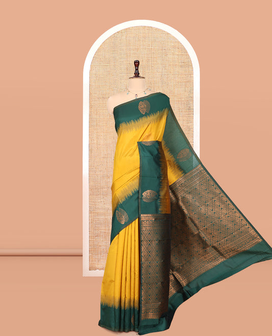 Mustard-Green Kanchi Silk Saree, Adorned with Zari Buttas, a Contrast Zari Butta Border, Grand Pallu, and a Contrast Blouse