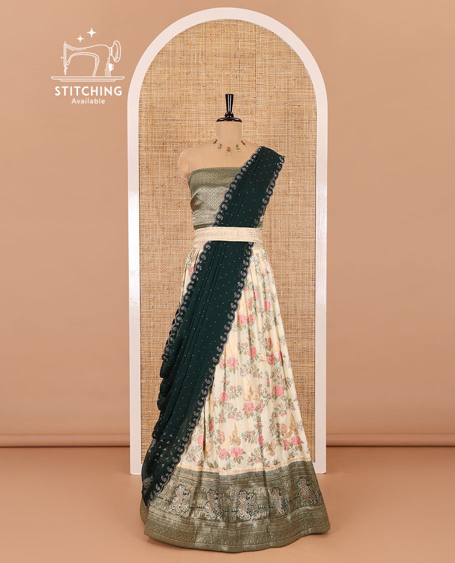 Cream and bottle green half-saree, floral and bird printed nylon viscose crepe top, contrast traditional zari and stone work border, jacquard banaras blouse, and scallop stone work dhavani