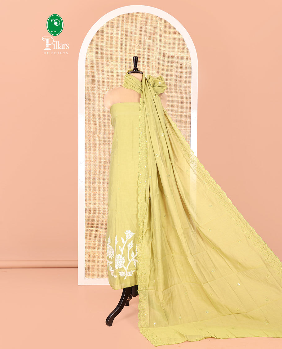 Green Mul Chanderi Material Chudidar Set, Accentuated with Appliqué Floral Embroidery on Its Top, a Plain Santoon Bottom, and Paired Scallop Embroidered Mul Chanderi Dupatta