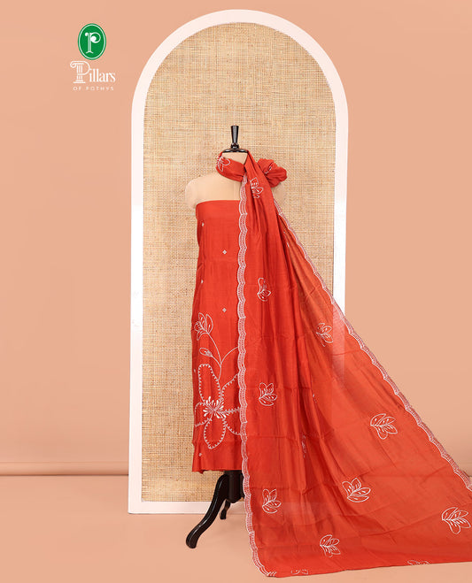 Rust Mul Chanderi Designer Material Chudidar Set, Meticulously Woven with Big Floral Motifs Embroidered On Its Top, A Plain Santoon Bottom, and Paired with a Mul Chanderi Scallop Thread Embroidered Dupatta