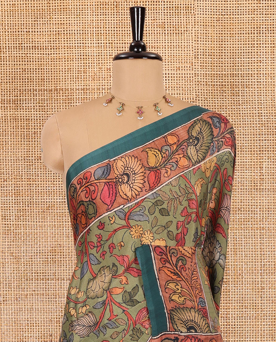 Leaf green kalamkari floral vine printed Italian crepe saree, contrast kalamkari floral creeper printed border, pallu of Pichwai and kalamkari print, and a plain blouse