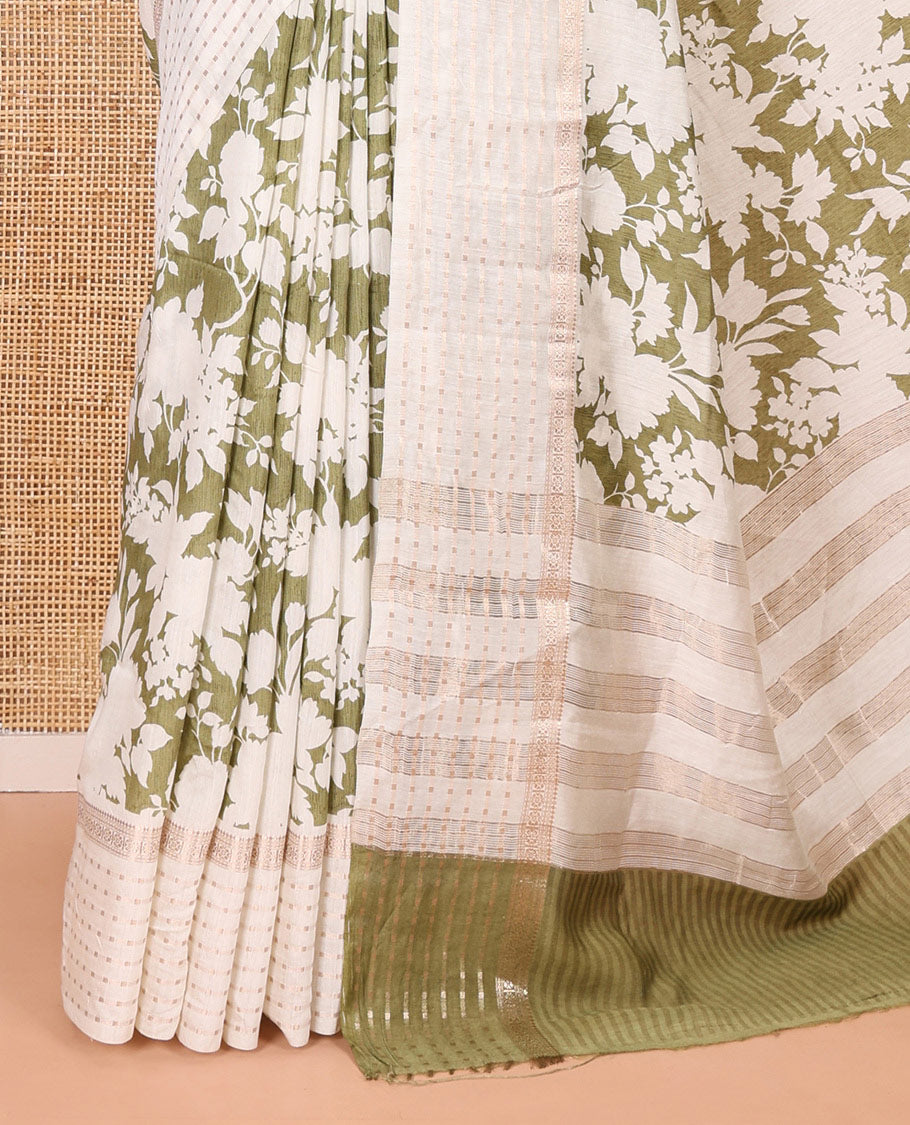 Olive green silhouette-style floral discharge printed Assam silk saree, contrast traditional zari border of rudraksham motifs, zari striped pallu, and a floral printed blouse