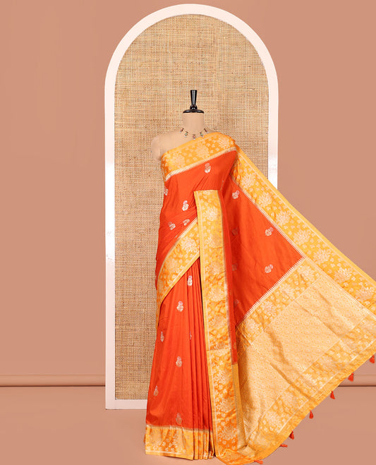 Orange Fancy Raw Silk Saree, Detailed with Floral Zari Buttas, a Contrast Floral Temple Border, Intricate Pallu, and a Contrast Blouse
