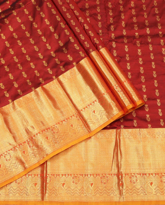 Maroon Pure Silk Half-Saree, Delicately Woven with Zari Buttas All Over Its Skirt, Complemented by a Contrast Border of Jaal, Floral, and Paisley Designs, Paired with a Contrast Blouse, and Comes with a Jaal Design Dhavani