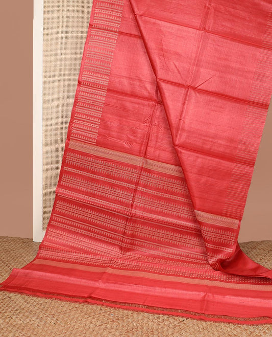 Pink plain tussar silk saree, self border and pallu features geometric patterns, and temple motifs